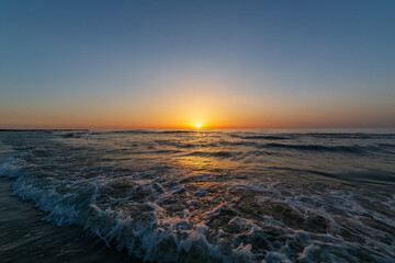 Obraz premium Sunset on the Baltic Sea in a summer evening