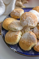 Homemade shortbread cookies with ginger and honey on a plate on the table, close-up. Delicious aromatic gingerbread pastry, copy space. DIY gingerbread cookies