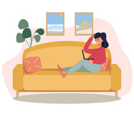 A pregnant girl is sitting on the couch with a laptop. The concept of online communication from home, school, work.