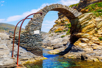 On the island of Andros, in the Cyclades archipelago, in the heart of the Aegean Sea, the old Venetian castle, on the islet connected to the city by a stone bridge, protected the city