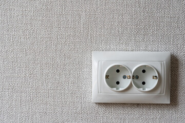 Electricity Outlet in Room after remodeling Process with Grey Wallpaper on Wall for Copy Space