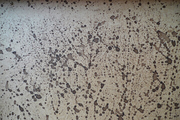 Bloated plywood splattered with brown ink 