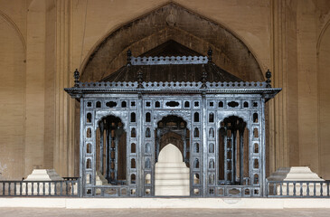 Vijayapura, Karnataka, India - November 8, 2013: Gol Gambaz Mausoleum. Main white tomb under blackish metal baldachin. under dome. © Klodien