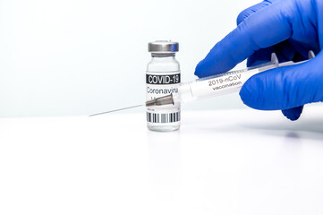 Covid-19 CORONAVIRUS VACCINE AND SYRINGE. Vaccination