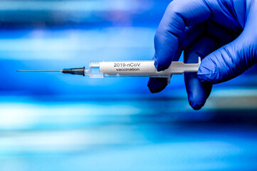 Covid-19 CORONAVIRUS VACCINE AND SYRINGE. Vaccination