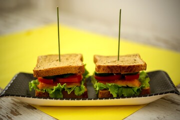 homemade sandwiches on a yellow background