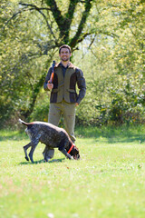 portrait of hunter and his dog