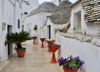 The trulli are drystone dwellings with conical roofs. AlberobelIo is one of the best preserved historical urban areas of this type in Europe.