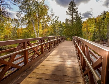 Beautiful wooden bridge over Gooseberry River at Gooseberry Falls State Park in northern Minnesota