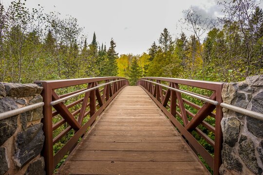 Wooden bridge over Gooseberry River at Gooseberry Falls State Park in northern Minnesota