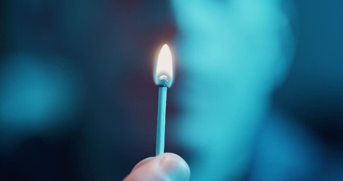 Striking a match on side of matchbox - macro close up 