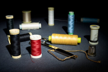 Red and other colored thread, buttons and sewing supplies 