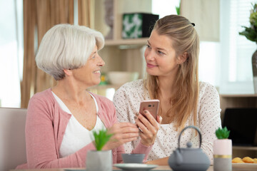 happy loving older mature mother and grown millennial daughter