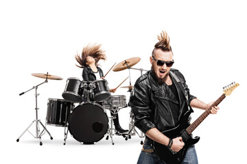 Fototapeta na wymiar Guitarist and female drummer in a punk band performing