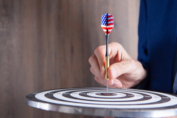 businessman holding in hand target .