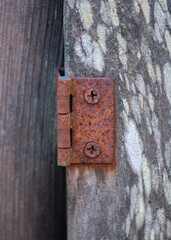 Rusty Hinge on weathered wood
