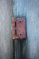 Rusty Hinge on weathered wood