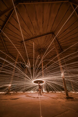 Long exposure, light painted steel wool spinning
