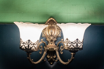 Closeup of chandelier sconces on the wall