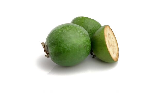 sliced feijoa isolated on white background
