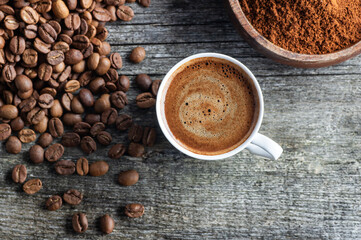 Turkish coffee concept, cup of coffee with coffee beans on wooden background