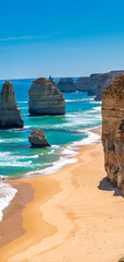 Amazing coastline of the Twelve Apostles, collection of limestone stacks off the shore of Port Campbell National Park, by the Great Ocean Road in Victoria, Australia on a beautiful day