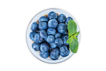 Blueberry Greek yogurt granola parfait in a glass on a white isolated background
