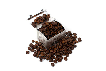 Roasted coffee beans in a small metal chest around it. Isolate on a white background. Copspace