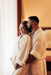 lovers in bathrobes in the bedroom