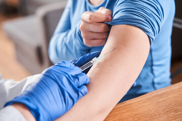 Doctor making a vaccination in the shoulder of patient