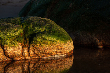 stones at sea at sunset and in the long exposition