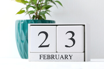 Text - February 23. White calendar with date 23 February. Russian holiday defender of the...