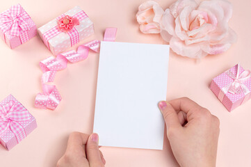 Blank card mockup in female hand for Valentine's Day