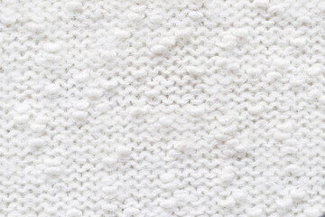 Knitted loops background. Knitted texture. White Knitted Fabric Texture. White knitting wool texture background. Wool sweater texture close up.