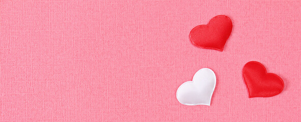 White heart and a red heart on a pink background. Concept for love day, Valentine's day, February 14th. Copy space. Valentine's Day card. Banner