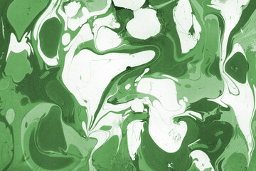 Green luxury marble ink texture on watercolor paper background. Marble stone image. Bath bomb effect. Psychedelic biomorphic art.