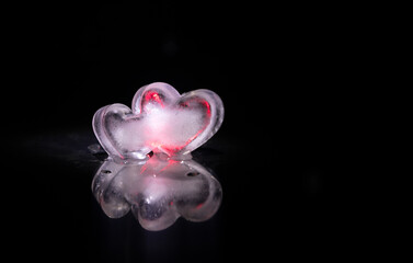 Valentines background. Valentine's Day heart on a dark wooden table. Toned, copy space