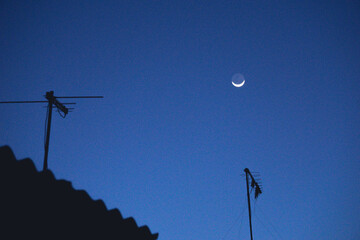 Fototapeta na wymiar Moon on the roof