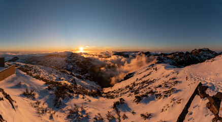 sunset in the mountains with snow