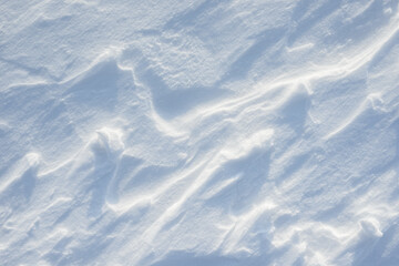 Fresh clean white snow background texture. Winter background with snowflakes and snow mounds. Snow lumps. Seasonal landscape details.