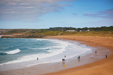 Wide sand beach near Cape Frehel, one of the most popular tourist destinations in Brittany, France