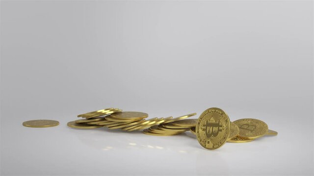 Gold coins fall on the glass surface. 3D animation.