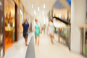 Unrecognizable women walking in the shopping center