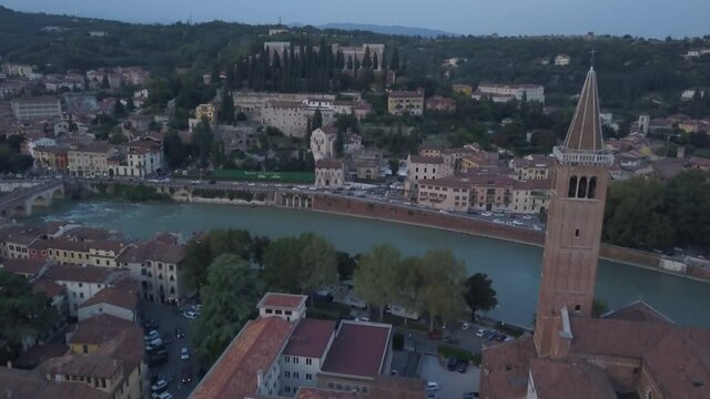 Center of Verona city in the evening from the sky. Aerial view of an ancient Italian city. 