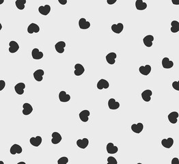 Endless seamless monochrome pattern of hearts of different directions. Black and white vector hearts. Wallpaper for wrapping paper.