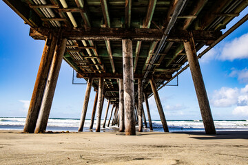 Underneath Imperial Beach pier around sunset