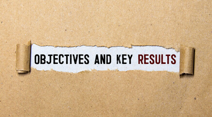 Objective Key Results text in the office notebook. View from above.