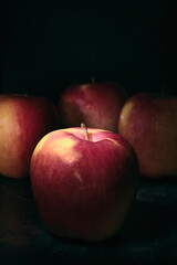 fresh and healthy fruit placed on a rustic table with very dark tones