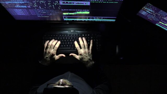 hacker coding at night cybersecurity concept