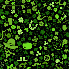 Seamless pattern on St. Patrick's Day made of clover leaves and other symbols in green colors